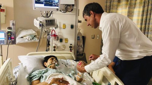 Presidential candidate Beto O'Rourke visits a survivor of the El Paso massacre.