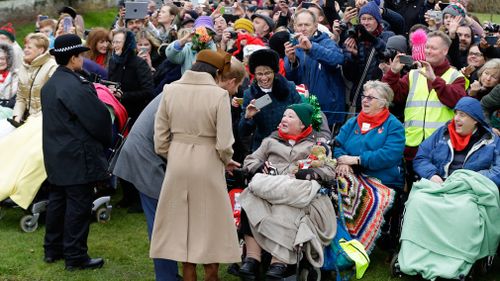 Prince Harry and Meghan Markle meet people outside St Mary Magdalene Church . (PA Wire)