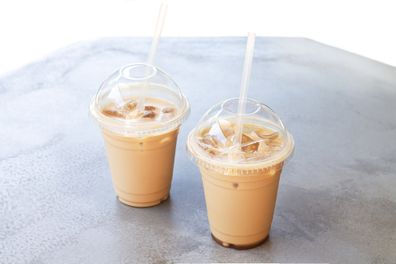 Iced Latte Or Iced Coffee In Takeaway Cup On White Background