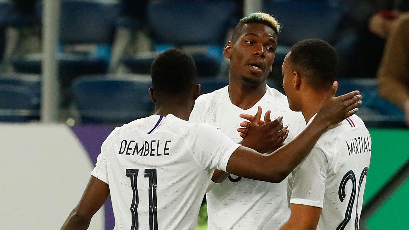 Paul Pogba of France celebrates with team mates after scoring
