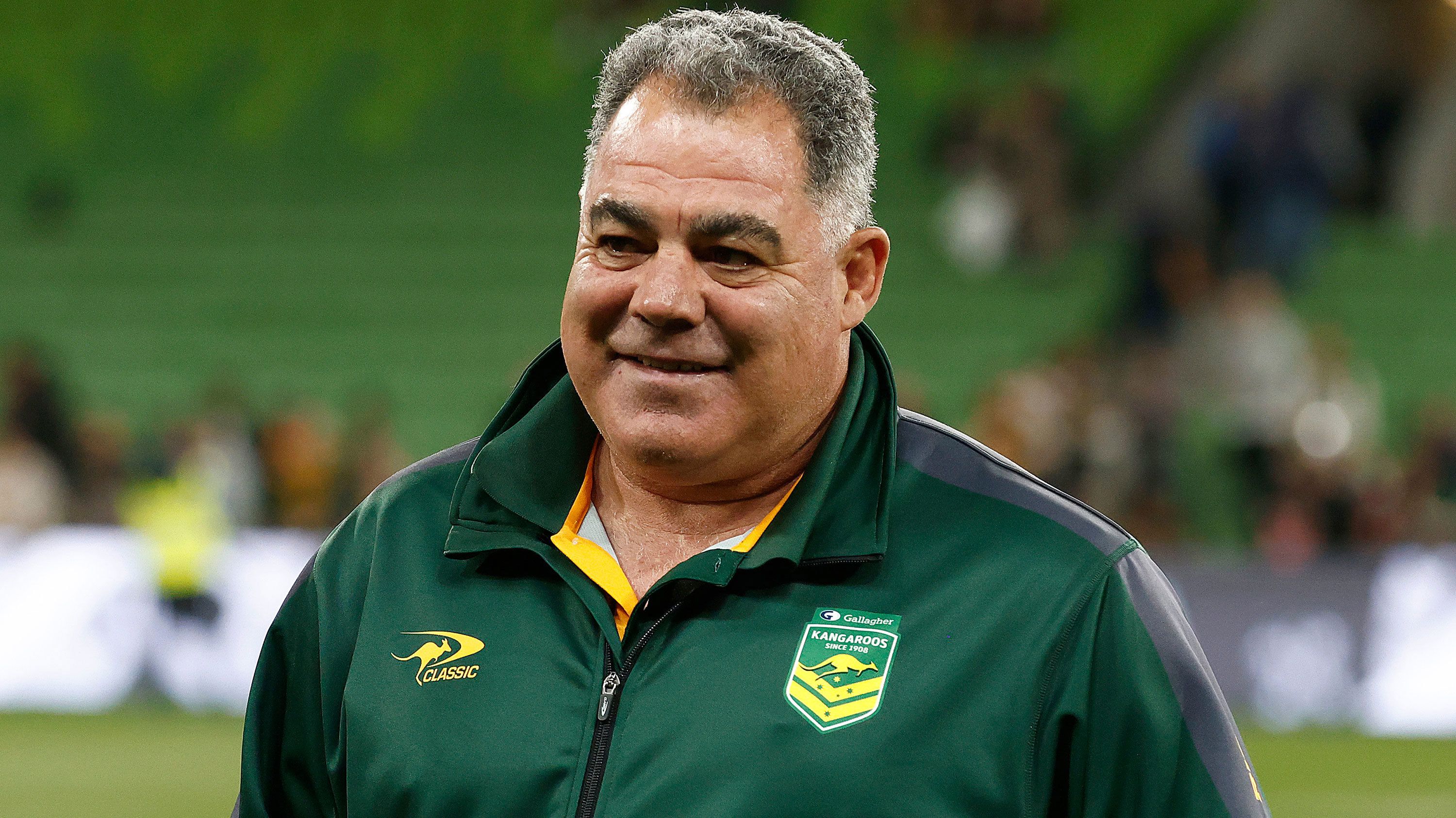 Kangaroos head coach Mal Meninga celebrates after winning the Pacific Championship match against New Zealand.