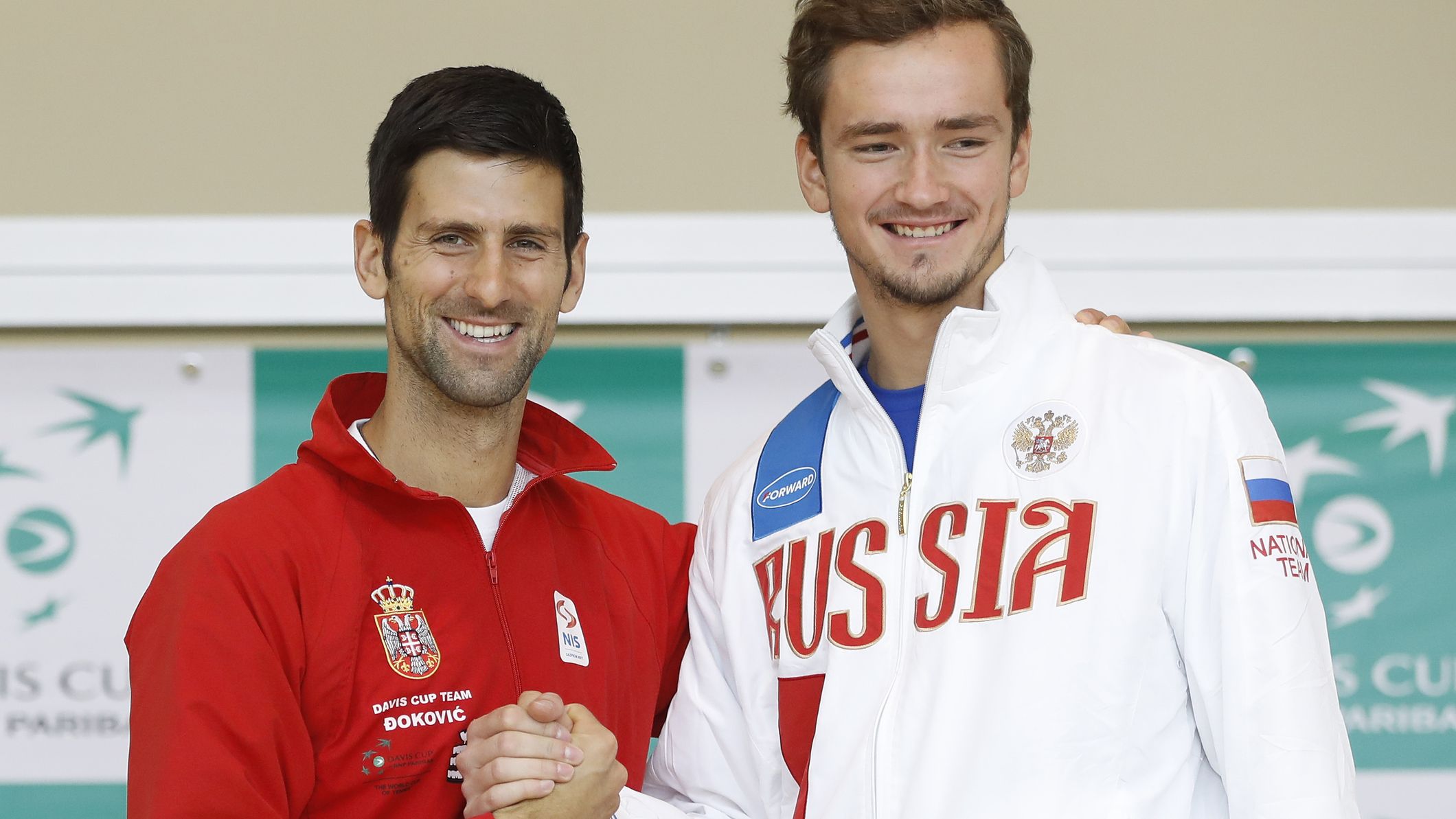Davis Cup team player Novak Djokovic (left) shakes hands with Daniil Medvedev, 20, during the official draw ceremony ahead of the World Group Davis Cup tie between Serbia and Russia in 2017.