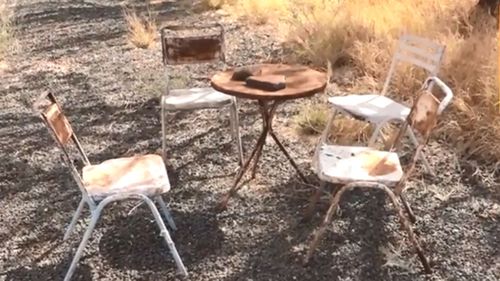 A table and chairs abandoned after the health risks posed by asbestos exposure was revealed. 