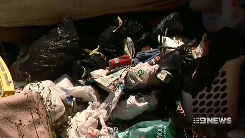 Piles of rubbish were allegedly discovered in the house.