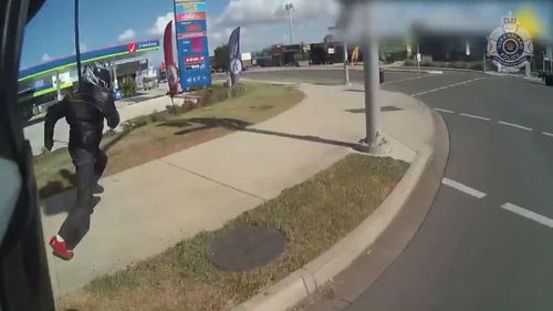 Bodycam footage captured the motorcyclist attempt to flee on foot as the highway officer gave chase.