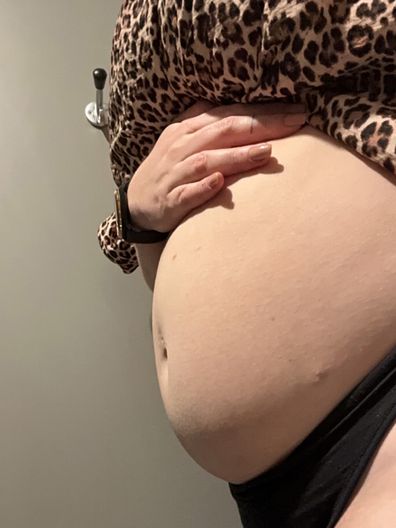 No, Caitlin Tiernan isn't pregnant - this is just bloating from endometriosis.