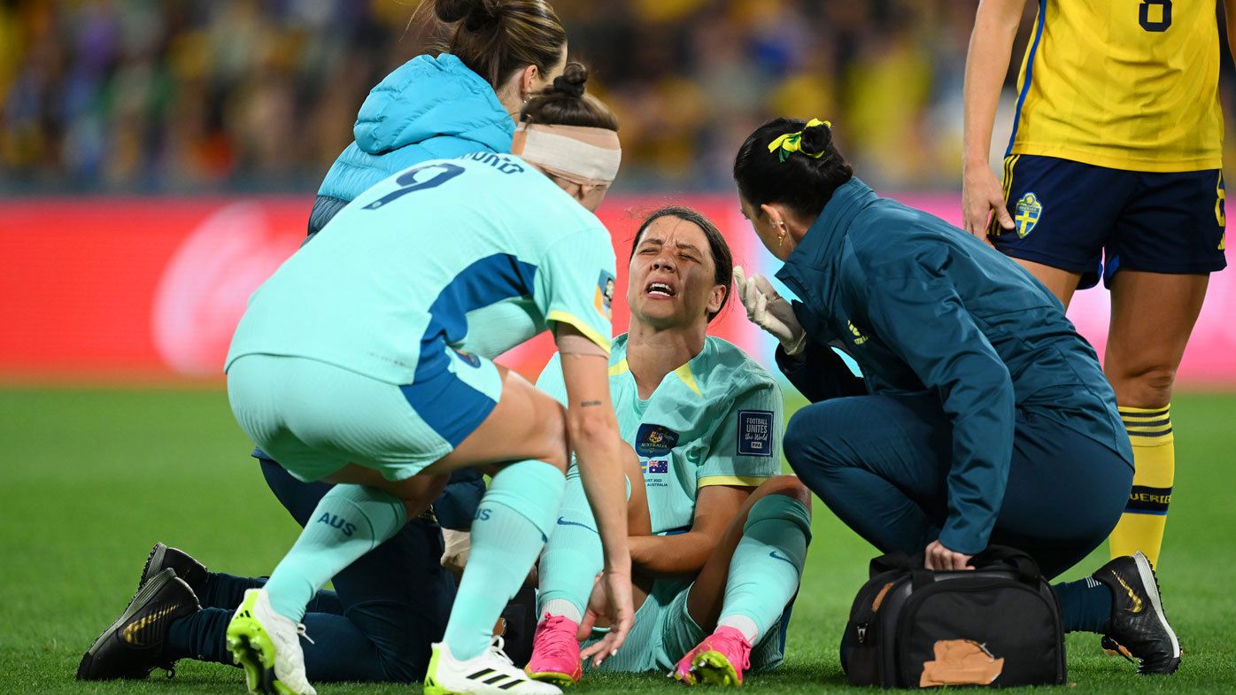 Matildas star Sam Kerr writhes in agony after injuring her leg.