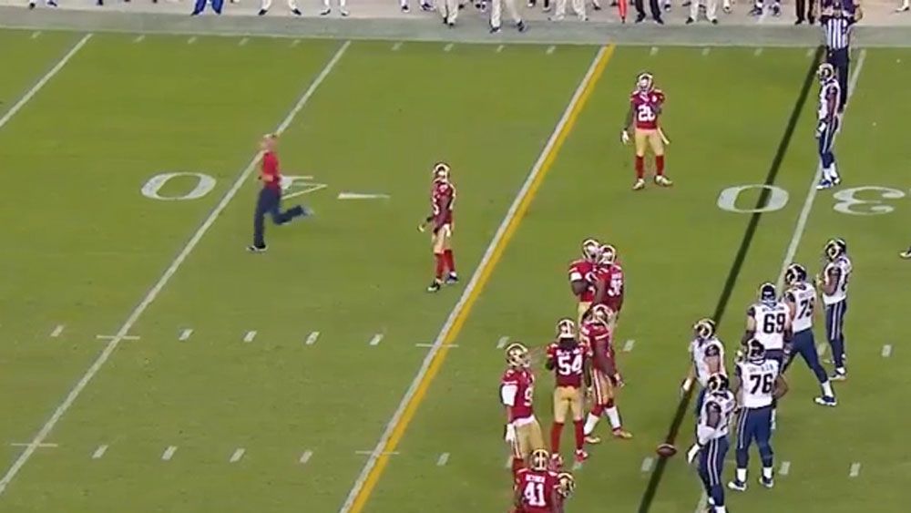 NFL: Commentator calls hilarious play after man invades pitch