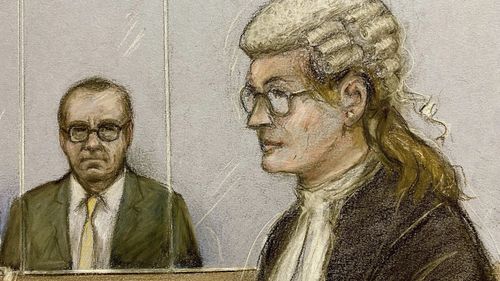 Court artist sketch by Elizabeth Cook of actor Kevin Spacey, left, in the dock as he listens to Christine Agnew KC, right, at Southwark Crown Court, London, Friday, June 30, 2023. 