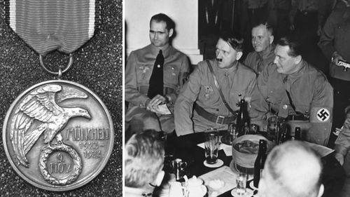 The silver medal which bears the Nazi eagle on one side and an image of the Munich monument, sold for a 'world record' price in an auction.