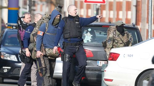 Two other men are still on the run as Belgian and French police shut down parts of Brussels. (AAP)
