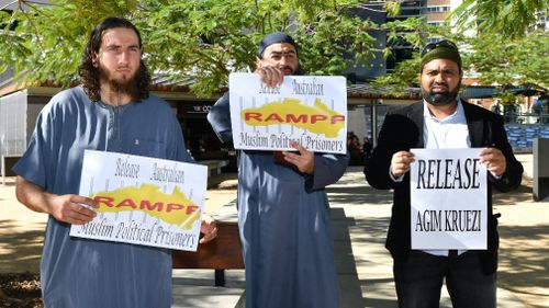 Supporters of Agim Kruezi are seen outside the Brisbane Supreme Court. Picture: AAP