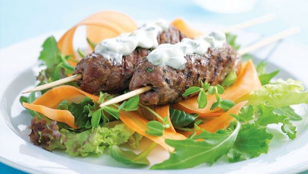 Beef skewers and carrot salad