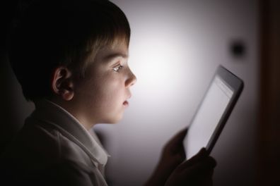 In this photograph illustration a ten-year-old boy uses an Apple Ipad tablet computer on November 29, 2011 in Knutsford, United Kingdom. Tablet computers have become the most wanted Christmas present for children between the ages of 6-11 years. Many parents are having to share their tablet computers with their children as software companies release hundredes of educational and fun applications each month.