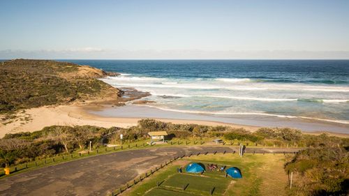 Despite the best efforts of surf lifesavers and other emergency service responders, a 55-year-old man died and his 20-year-old son is in hospital after getting into difficulty in a rip at Frazer Park Beach on the NSW Central Coast.