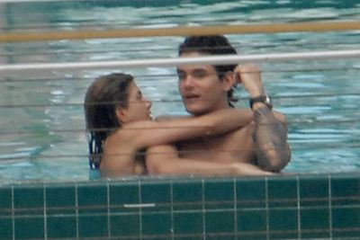 Jen and ex John Mayer on holiday in 2008. Yes, she IS wearing a bikini (it's flesh-pink!).