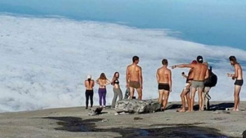 Malaysian authorities took action against these western tourists after they stripped on top of a sacred mountain in 2015.