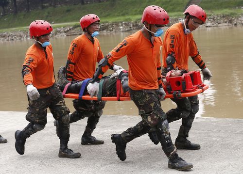 Rescue crews practice drills ahead of the typhoon which is set to make landfall tomorrow.