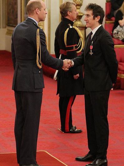 Prince Harry presenting Geraint Thomas with his OBE 