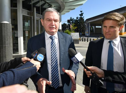 Former Ipswich mayor Paul Pisasale (left) is seen leaving the Brisbane Magistrates Court today. 