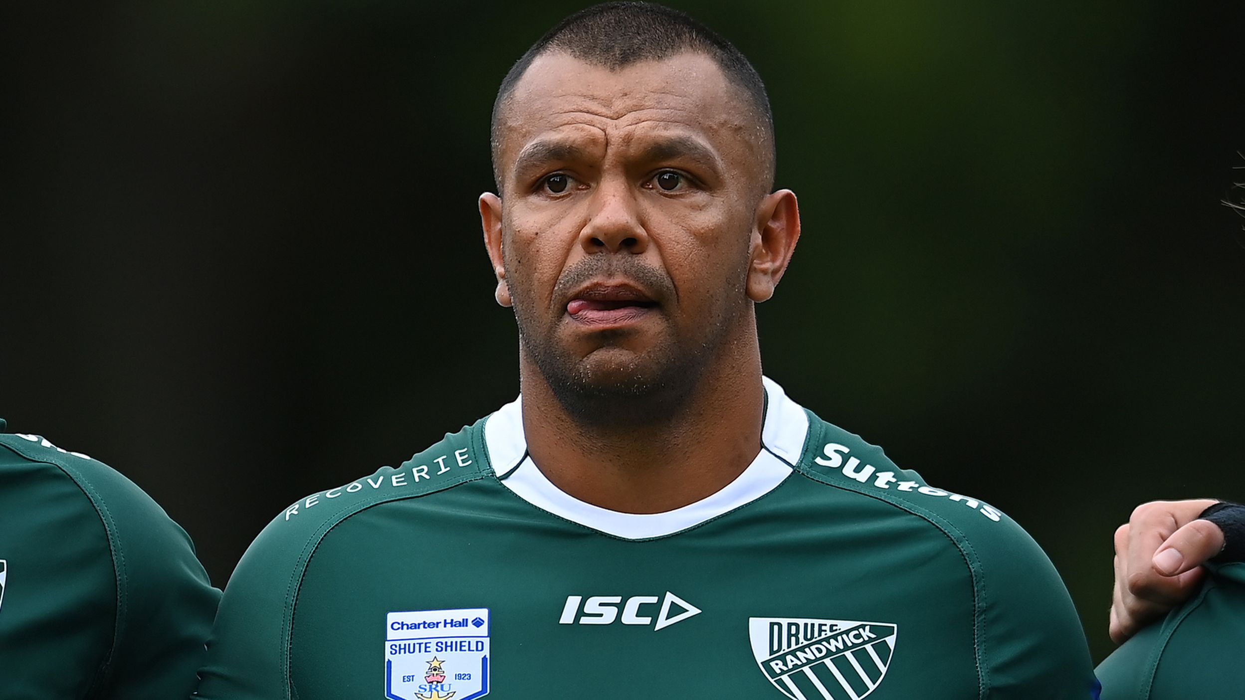 Kurtley Beale of Randwick sings the national anthem at Crosby Park.