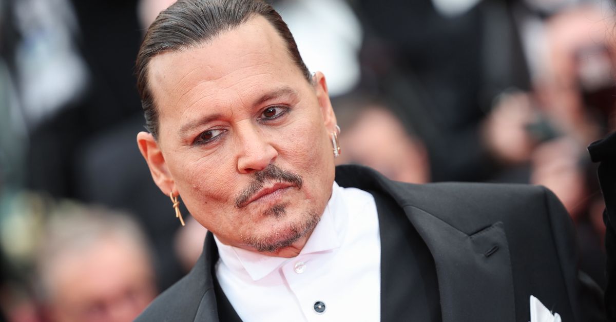 Johnny Depp greeted with cheers at Cannes Film Festival as Amber Heard ...