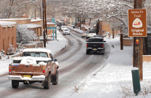 The snow across the northern Plains and upper Midwest was expected to wind down throughout Friday morning, but blowing snow was limiting visibility