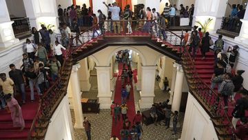 People arrive at the official residence of President Gotabaya Rajapaksa four days after it was stormed by anti-government protesters in Colombo.