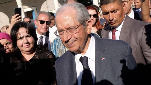 Tunisian Parliament Speaker Mohamed Ennaceur leaves parliament after being sworn in as Interim president in Tunis.