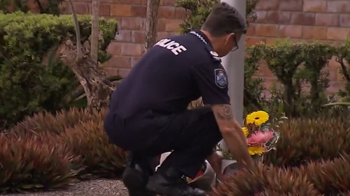 Queensland Police officer David Masters killed by car while laying road spikes to stop allegedly stolen car.