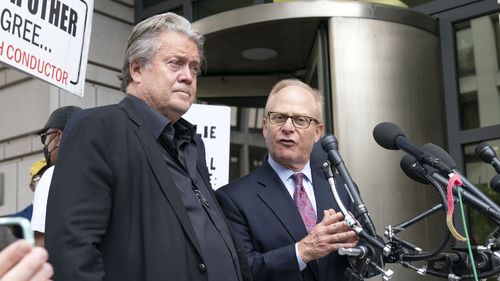 Steve Bannon accompanied by his attorney David Schoen, speaks to the media as he departs the federal court in Washington, Thursday, July 21, 2022. Bannon was brought to trial on a pair of federal charges for criminal contempt of Congress after refusing to cooperate with the House committee investigating the U.S. Capitol insurrection on Jan. 6, 2021. (AP Photo/Jose Luis Magana)