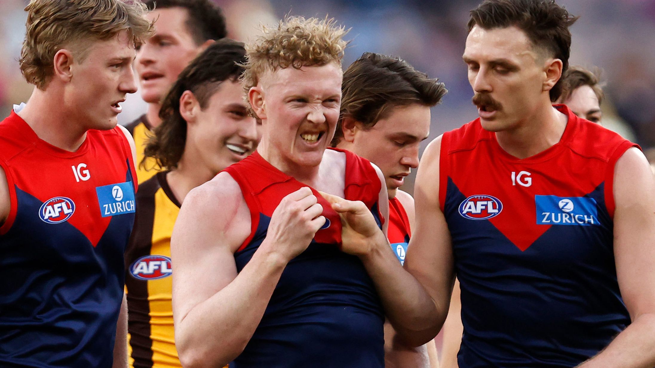 Jake Lever (right) drags teammate Clayton Oliver away from a wrestle during the round 23 AFL match between Melbourne Demons and Hawthorn Hawks at Melbourne Cricket Ground, on August 20, 2023, in Melbourne, Australia. 