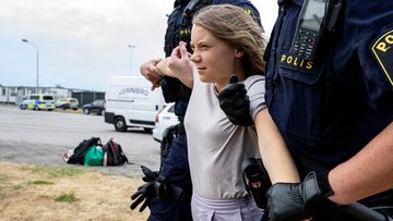 FILE PHOTO: Police remove Greta Thunberg as they move climate activists from the organisation Ta Tillbaka Framtiden, who are blocking the entrance to Oljehamnen in Malmo, Sweden, June 19.