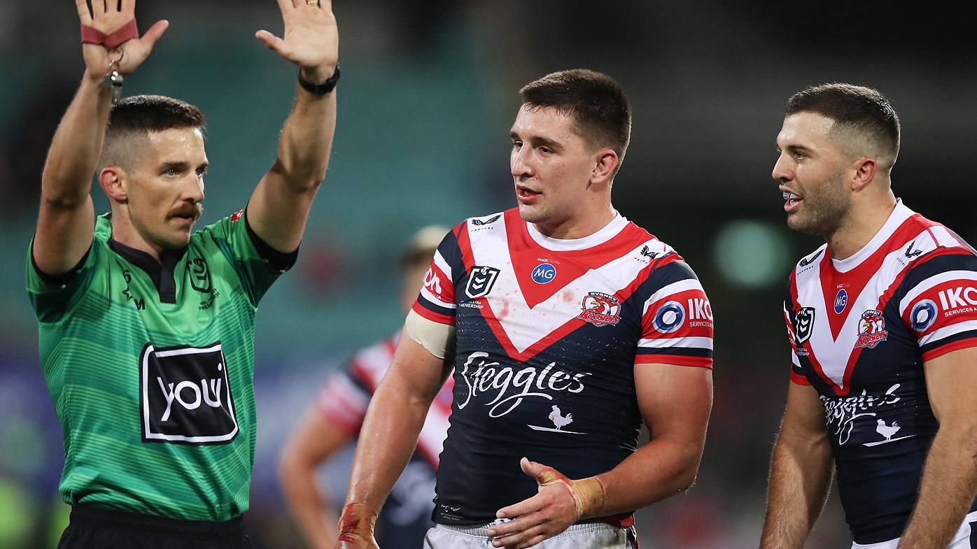 Victor Radley of the Roosters is sent to the sin bin by referee Peter Gough as James Tedesco looks on 