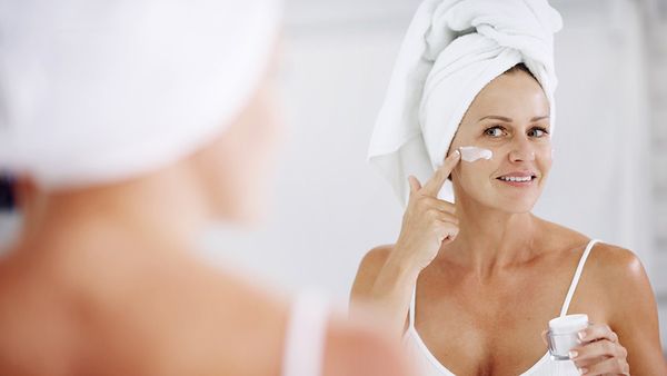 Woman applying skincare