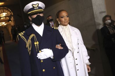 Jennifer Lopez is escorted to the 59th Presidential Inauguration at the U.S. Capitol for President-elect Joe Biden in Washington, Wednesday, Jan. 20, 2021. 