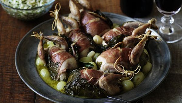 Roast quail wrapped in vine leaves with grapes and herbed orzo