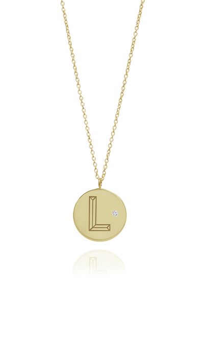 <p><a href="https://www.notjustalabel.com/shop/myiabonner/gold-diamond-initial-necklace" target="_blank">Gold With Diamond Initial Necklace, approx. $457, Myia Bonner</a></p>