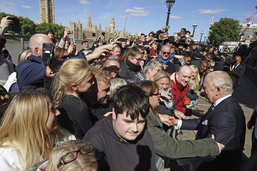 Britain's King Charles III meets members of the public in the queue along the South Bank, near to Lambeth Bridge.