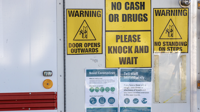 Signage cautioning against the coronavirus (COVID-19) are seen on a dental clinic van at Surfers Paradise on July 15, 2020 in Gold Coast, Australia. 