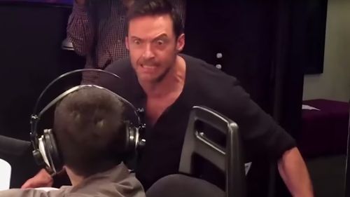 Jackman surprised Domenic by diving into the room and straight into his iconic Wolverine pose. (YouTube)