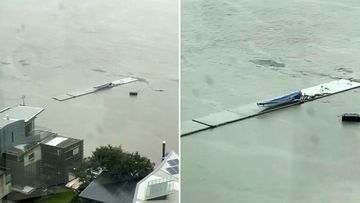 A 40-metre piece of a concrete pier is floating down Brisbane River.