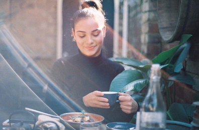 Young woman eating outdoors