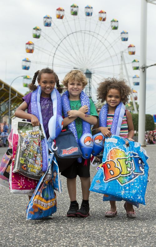 Children with showbags at the Royal Easter Show in Sydney. (AAP)