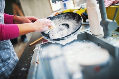 Woman washing dishes