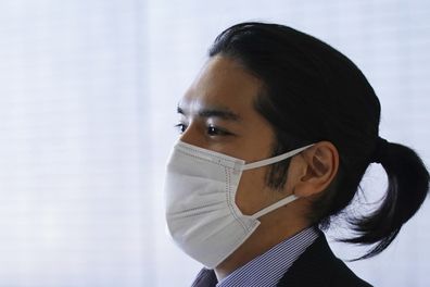 Kei Komuro, fiance of Princess Mako, arrives at Narita international airport in Narita, near Tokyo. Sports ponytail