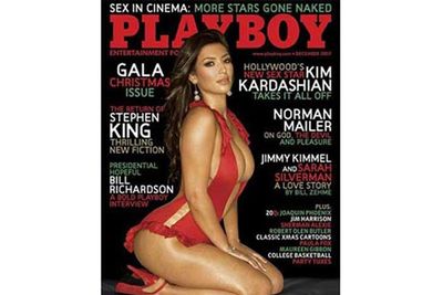 Kim Kardashian poses in a skimpy swimsuit for <i>Playboy</i> magazine - and poses in much less inside - a move she says she regrets.