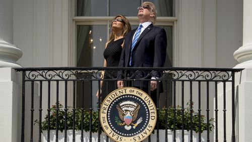 President Trump and first lady Melania Trump watch the solar eclipse at the White House on Aug. 21, 2017. Photo: AP