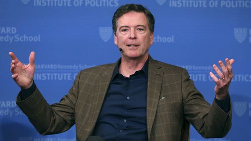 FILE - Former FBI director James Comey gestures while speaking at Harvard University's Institute of Politics' JFK Jr. Forum in Cambridge, Mass., Feb. 24, 2020. (AP Photo/Charles Krupa, File)