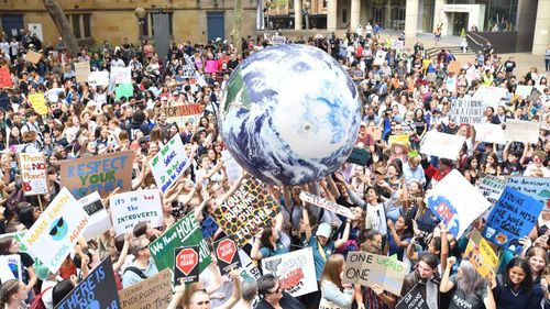 Students outside Sydney Town Hall protest climate change inaction.